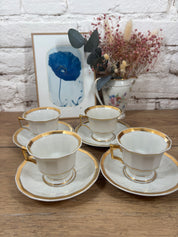 Tasse et soucoupe en porcelaine blanche et vert d'eau ornée de dorures, signé Jammet Seignolles à Limoges.