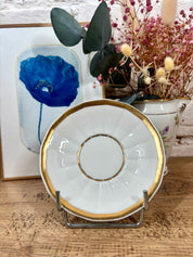 Tasse et soucoupe en porcelaine blanche et vert d'eau ornée de dorures, signé Jammet Seignolles à Limoges.